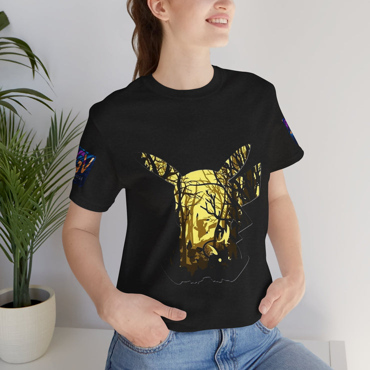Person wearing a black t-shirt with a gold graphic design, standing indoors next to a plant.
