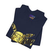 Folded navy blue shirt with yellow tree design on a white background