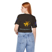 Person wearing a black t-shirt with a Pokémon design and text on a white background